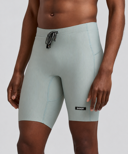 Men's Cadence 7 Pocket Half Tights Lagoon / Copal - vista frontal en modelo