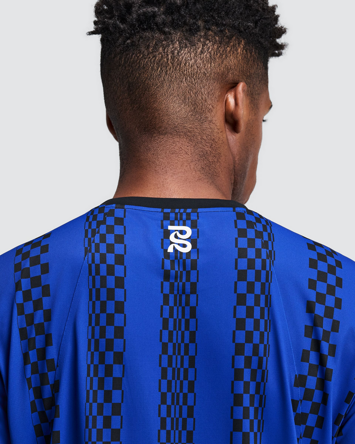 Polo de running Bandit Specter con Flopack para hombre, color Bauhaus Blue - detalle posterior