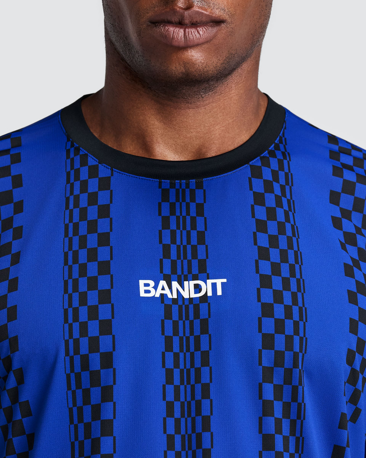 Polo de running Bandit Specter con Flopack para hombre, color Bauhaus Blue - detalle frontal