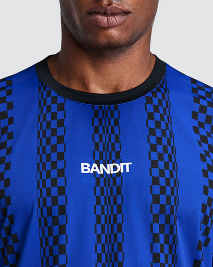Polo de running Bandit Specter con Flopack para hombre, color Bauhaus Blue - detalle frontal