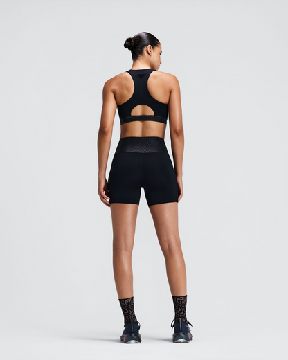 Top deportivo Bandit Stamina-V Threshold para mujer, color negro - vista frontal de cuerpo entero