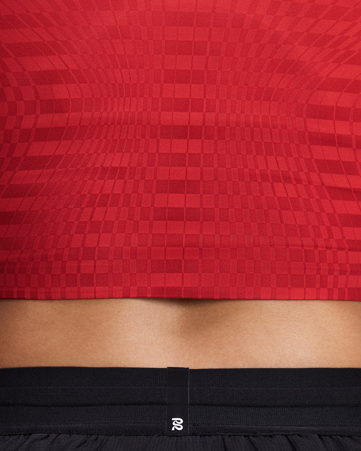 Top de competencia Bandit Adapto para mujer, color Oxide Red - detalle de la tela