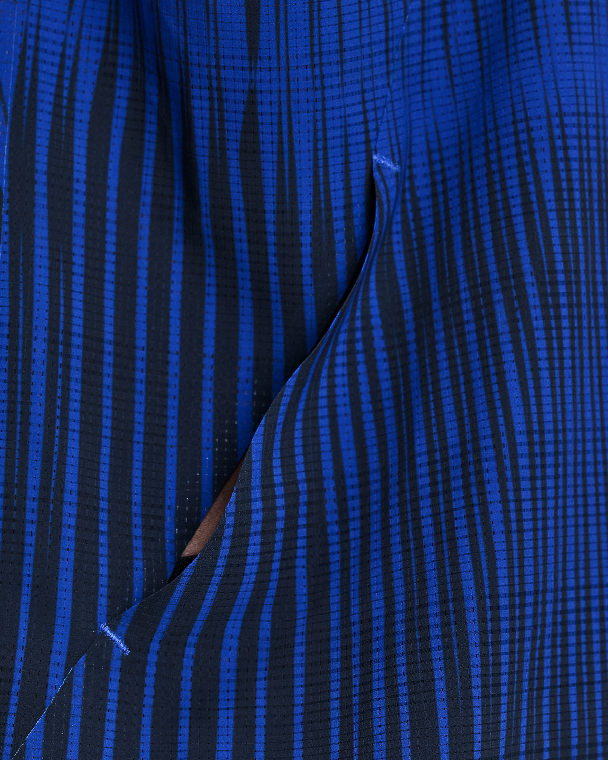 Bividí Bandit CoolGrid Distance con Flopack para hombre, color Bauhaus Blue - detalle del bolsillo Flopack