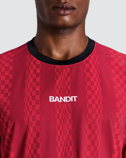 Polo de running Bandit Specter con Flopack para hombre, color Oxide Red - detalle frontal