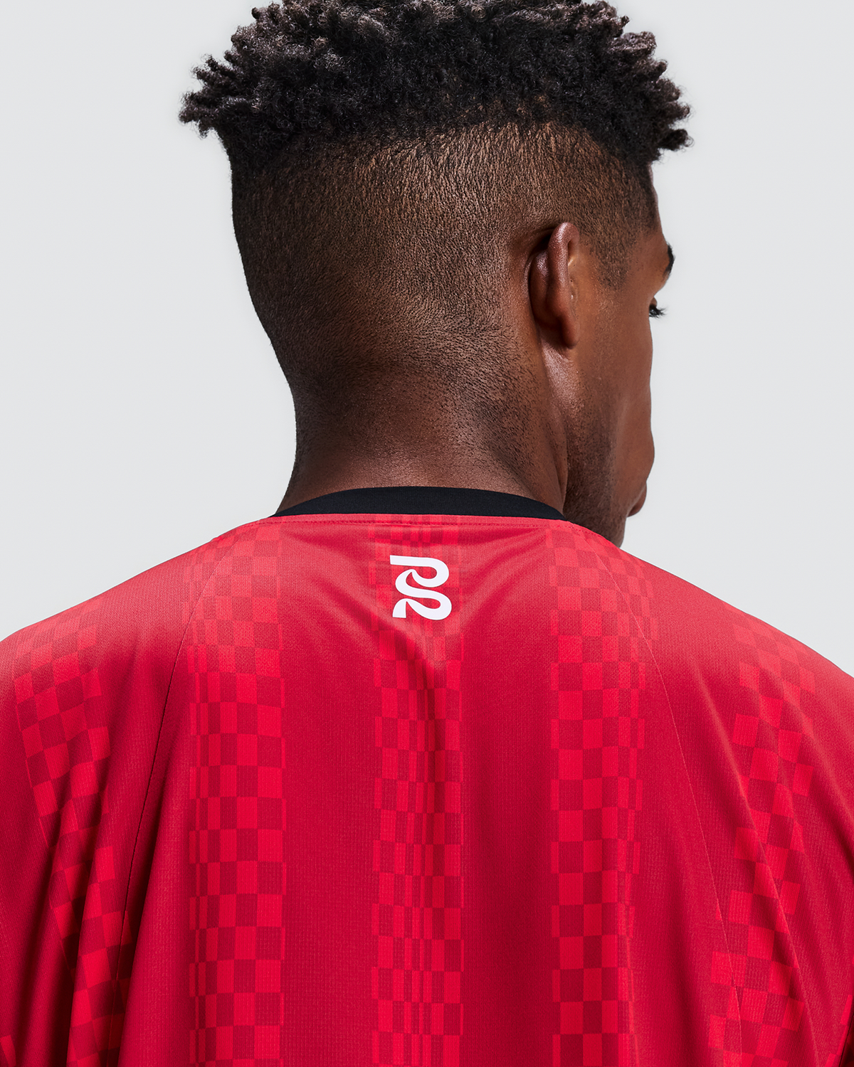 Polo de running Bandit Specter con Flopack para hombre, color Oxide Red - detalle posterior