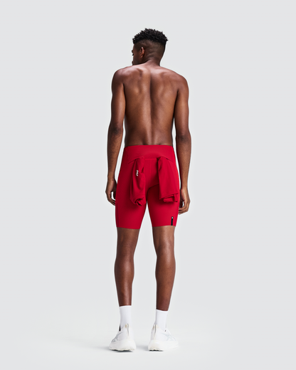 Malla corta Bandit Cadence 7 Pocket para hombre, color Striped Oxide Red / Signal Red - vista posterior de cuerpo entero